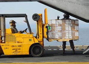 320px-US_Navy_110322-N-8607R-311_Marines_load_humanitarian_assistance_supplies_onto_a_CH-53E_Sea_Stallion_helicopter_aboard_the_forward-deployed_amphibio